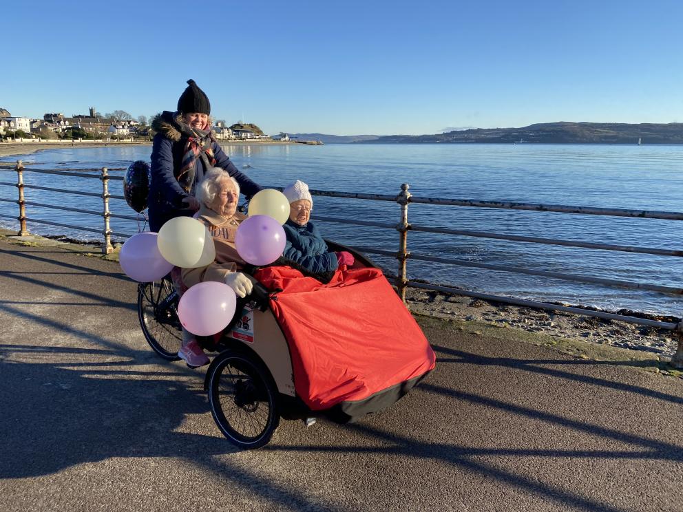 Cowal Befrienders volunteer Kate taking Kath and Mary our on the trishaw bike to celebrate Kath's 102nd birthday 