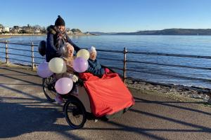 Cowal Befrienders volunteer Kate taking Kath and Mary our on the trishaw bike to celebrate Kath's 102nd birthday 
