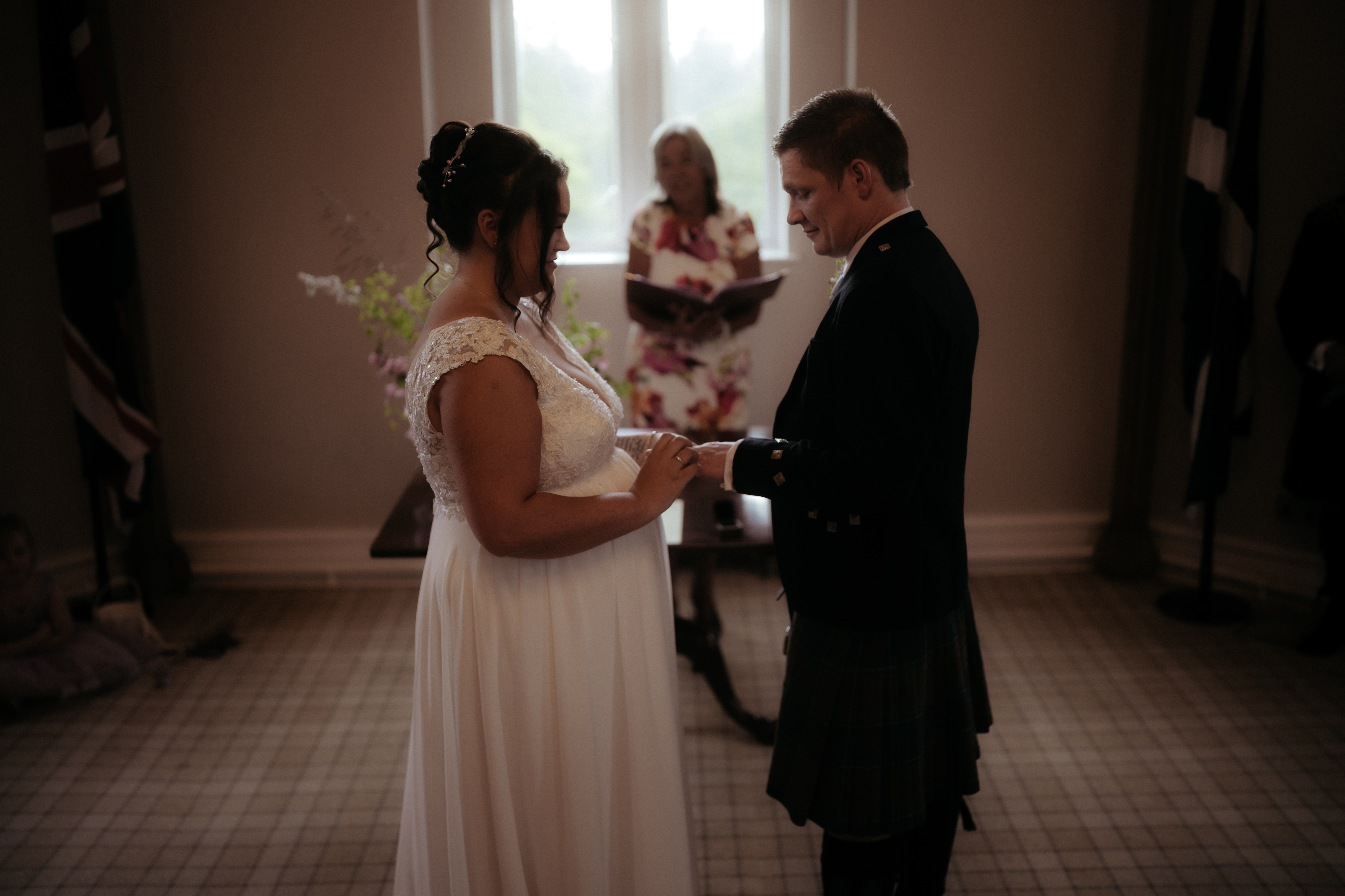 3 people standing for a wedding ceremony