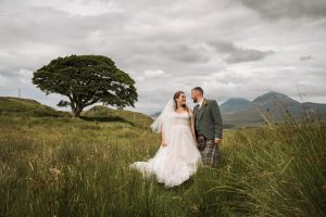 Man and Woman standing looking at each other in a field