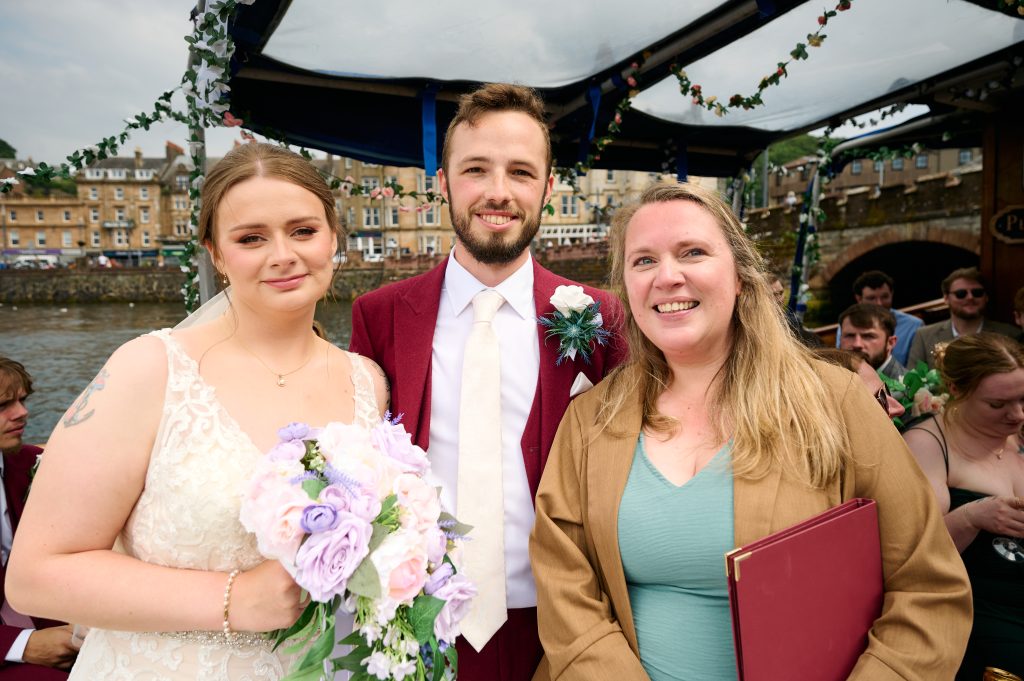 2 woman with a man in the middle