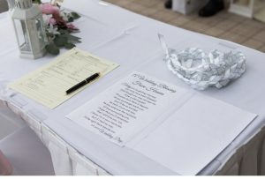 a table with marriage paperwork and a reading on it