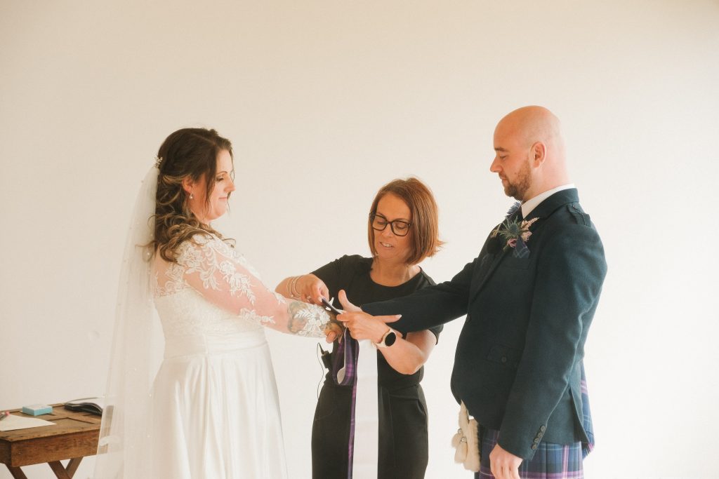2 woman and a man standing