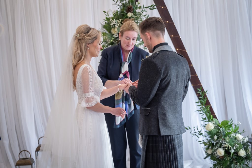 2 woman and a man standing