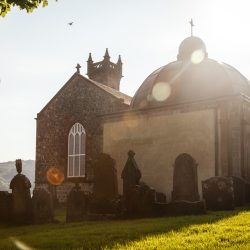 External view of kilmun with sun low in the sky