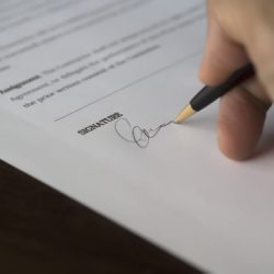 Hand signing paperwork