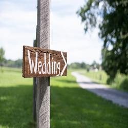 Sign pointing to Wedding Day