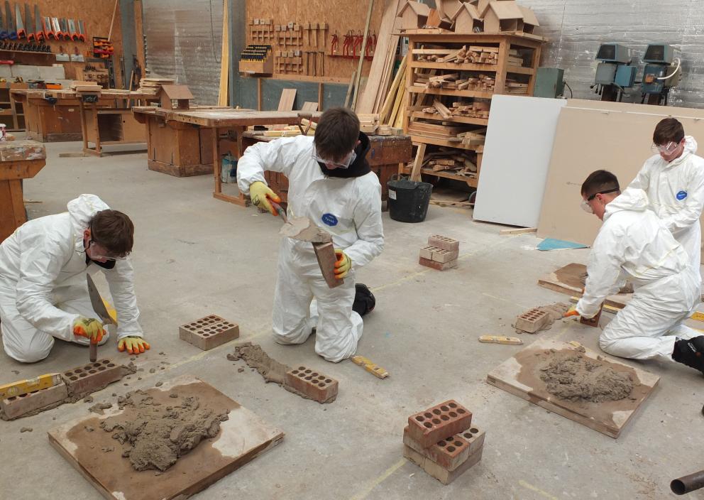 Pupils trying their hand at brickwork 