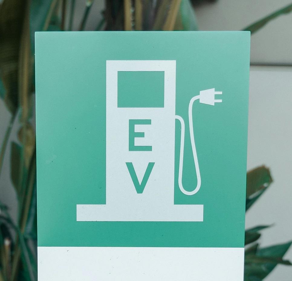Sign showing an EV charging poing