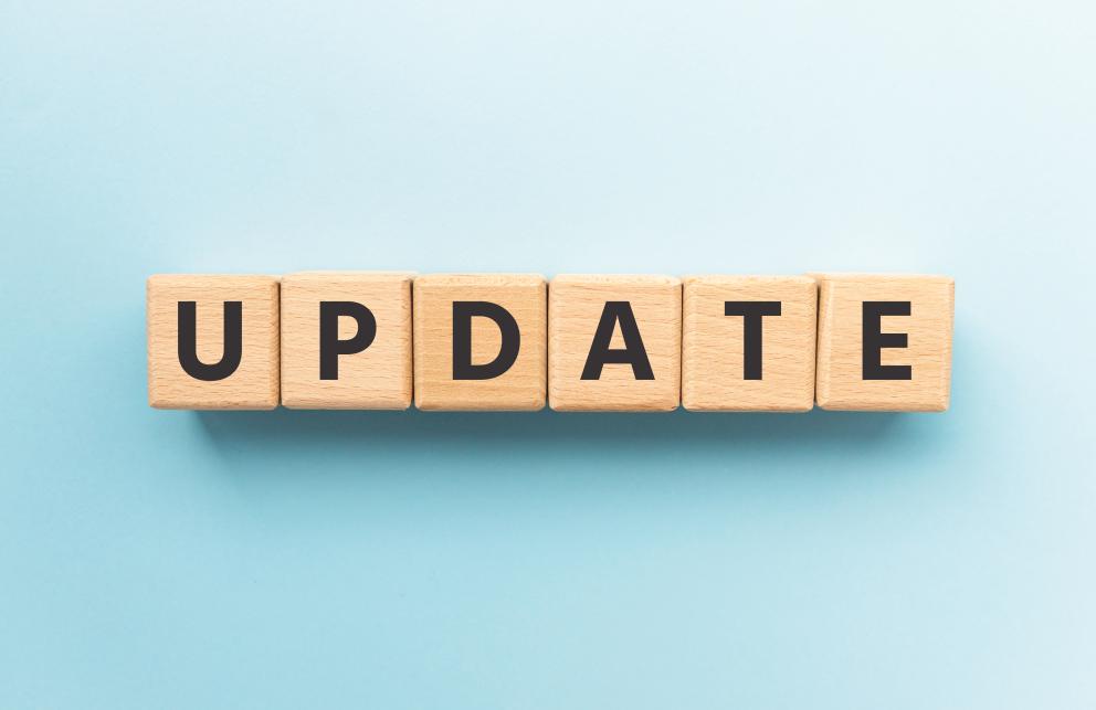 Images shows wooden letters spelling out the word update on a blue background