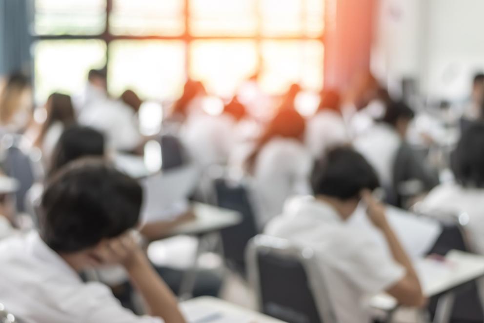 Image shows students sitting their exams