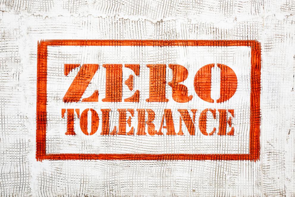 Image shows the words in red zero tolerance outlined with a red border on a white background