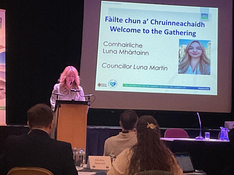 Image shows Councillor Luna Martin speaking at the Gaelic Gathering event