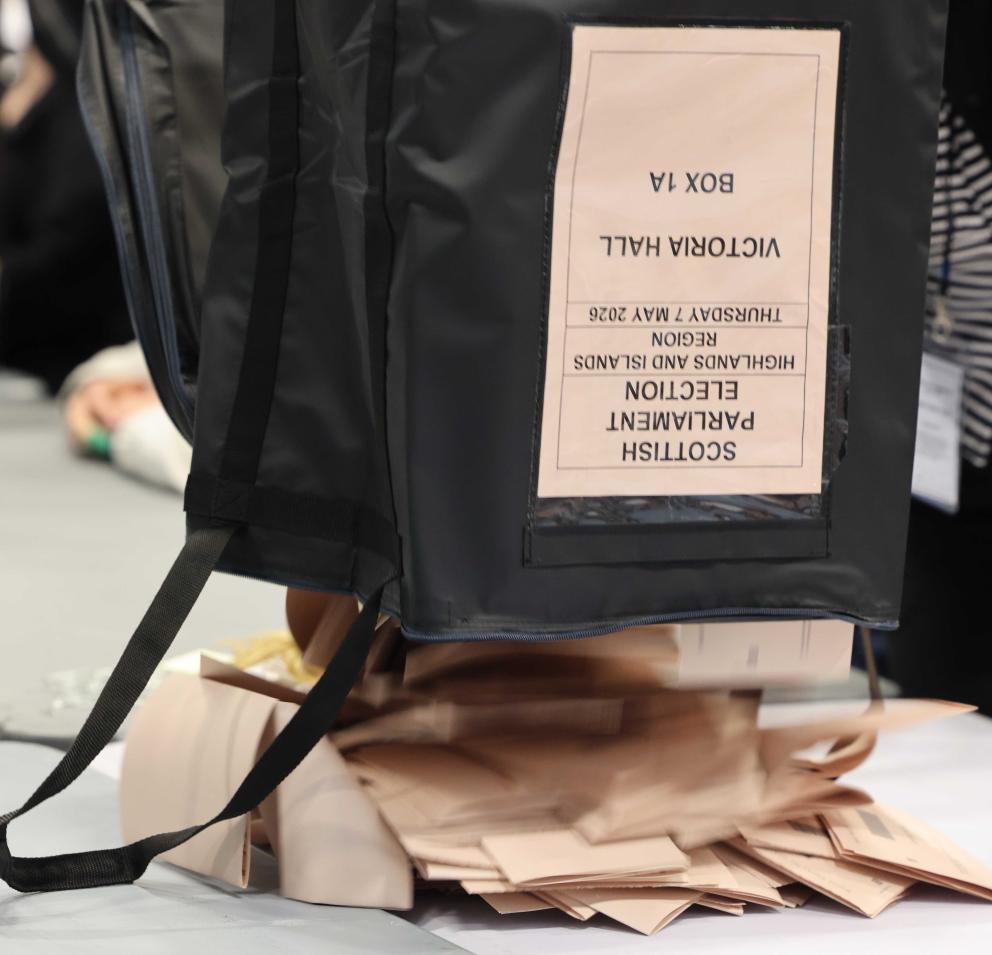 ballot box being emptied