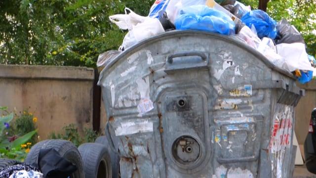 overflowing rubbish bin