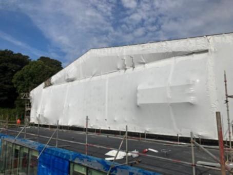 Main Roof (Roof 1) Scaffold South facing elevation with shrink-wrap polythene sheeting to temporary roof/scaffold. 