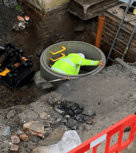 In front yard adjacent exit from Staircase north east corner of building.