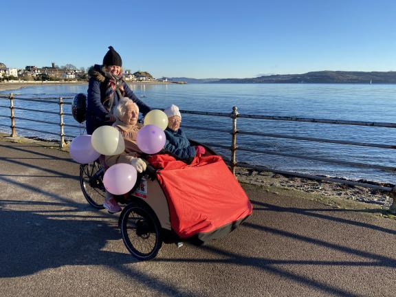 Kate, Kath and Mary all making a better journey on the trishaw bike, to celebrate Kath’s 102nd birthday