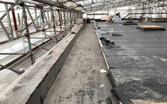 installation of roof membrane/flashings to parapet