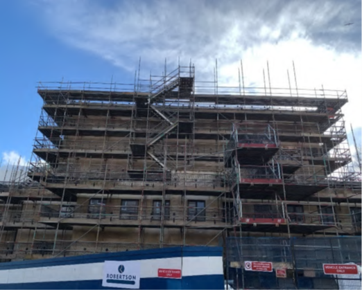 North Elevation (Viewed from Mackinlay Street): scaffold extended to north side of building in preparation for temporary roof protection.