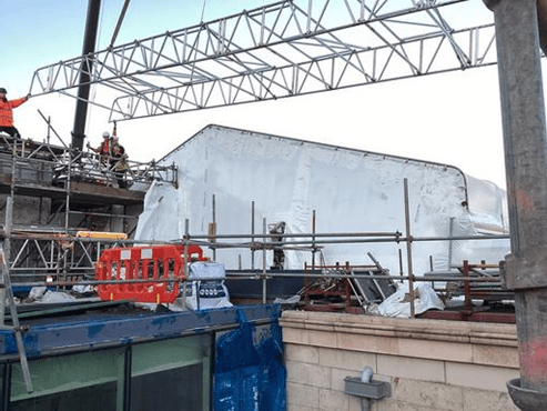 Assembly of temporary roof structure.