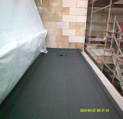 The new roof membrane partially laid.  The edge detail is work in progress to improve the discharge of rainwater.