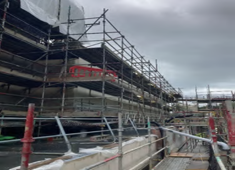 Protective coverings being removed following completion of render works