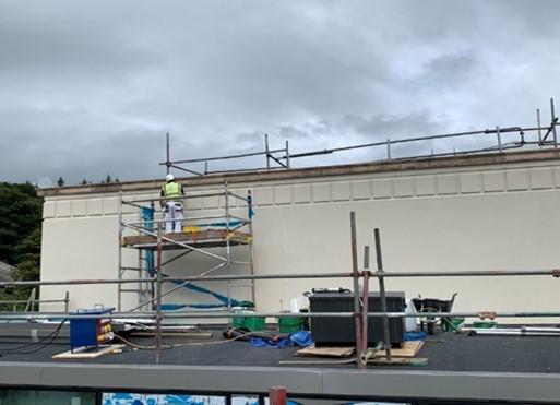 Main Building (South Elevation) application of sealer coat to rendered south elevation over roof 5