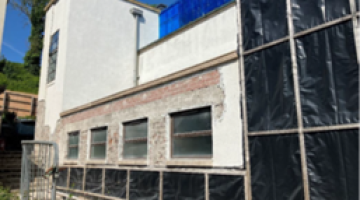 Removal of render to south elevation has started exposing brickwork