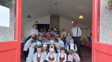 Image shows young people from Achievement Bute enjoying history outdoor activities 