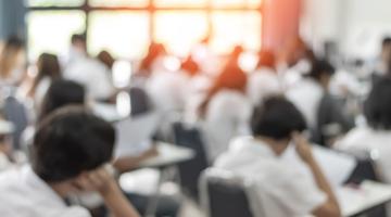 Image shows students sitting their exams