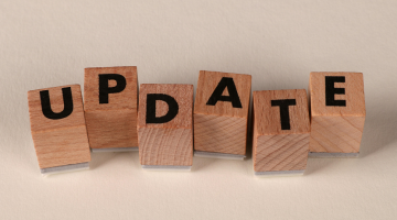 wooden blocks spelling out the word update