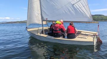 Image shows a small sailing vessel on the water. Bendoran Watersports is a social enterprise that provides watersports for the local community with the aim of improving emotional and physical wellbeing of local people. This local charity benefited from the Fund. 
