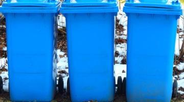 three blue wheelie bins