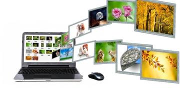 laptop with photos coming out of the screen in waves