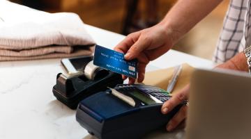 picture of a person using a credit card