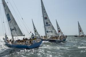Images shows two racing yachts in the foreground and three in the background. (credit clipperroundtheworld.com)
