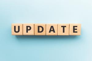 Images shows wooden letters spelling out the word update on a blue background
