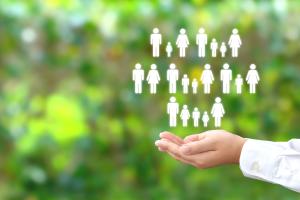 Hand holding cartoon people