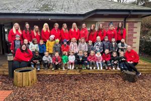 Images shows nursery children and staff pictured outside