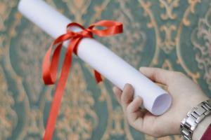 Hand holding a scroll