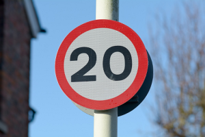 a 20 mph sign on a pole