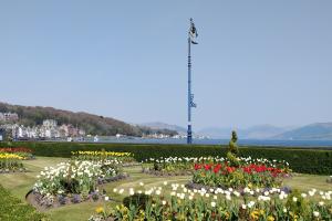 A view of the green at Rothesay with colourful flower beds