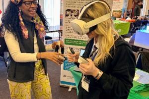 Image shows a student using a virtual reality headset