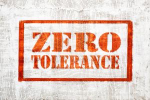 Image shows the words in red zero tolerance outlined with a red border on a white background