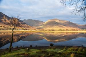 Image shows reflection in the water of the Loch Awe 