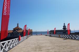 Dunoon Pier with Dunoon Presents' flags