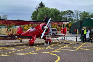 Man filling up plane with fuel