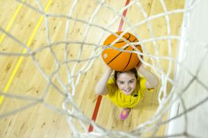 A school pupil playing basketball