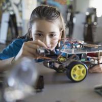 Teenage girl working on a project in a classroom